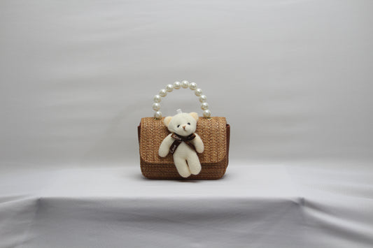 Artisanal Woven Straw Mini Bag with Pearl Handle & Teddy Charm